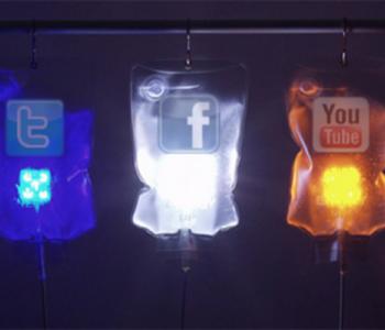 Colored IV bags with the logos of popular social media sites: Twitter, Facebook, and YouTube
