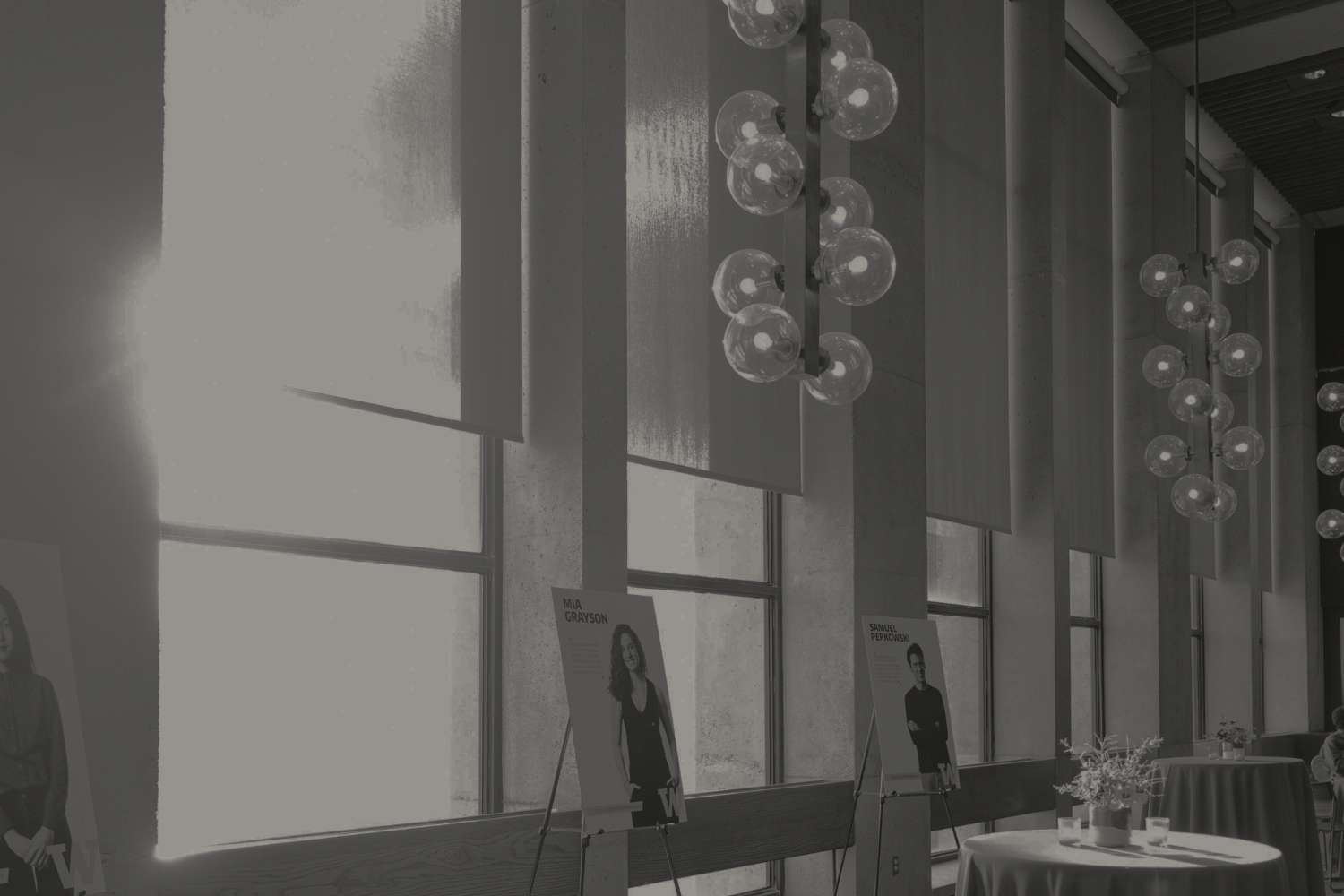 Black-and-white photo of the windows and light fixtures of the Walker-Ames room.