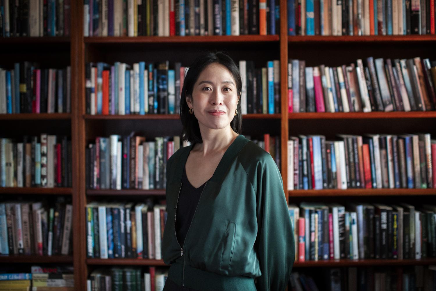 Tiffany Tsao in front of a bookshelf. Photo by Joy Mei En Lai.