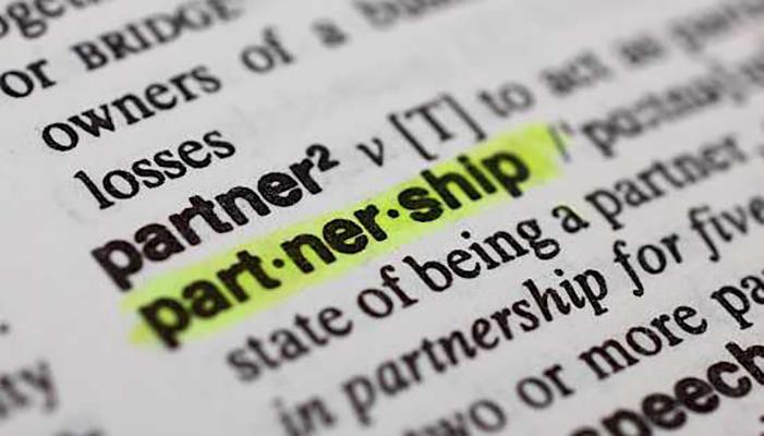 A close-up of the dictionary entry for "partnership," highlighted