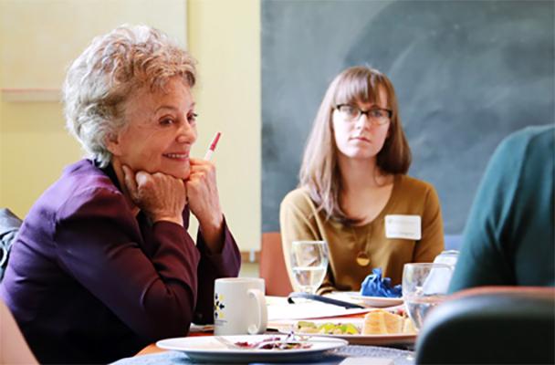 Stephanie Coontz talking to graduate students at the Simpson Center for the Humanities.