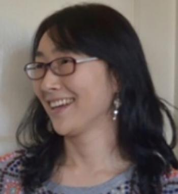 Heekyoung Cho looks to the left while wearing glasses.