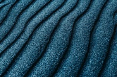An abstract image of waves of turquoise.