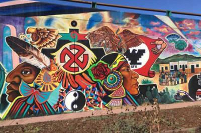 "Quetzalocoatl" is the first collective mural painted in Chicano Park, San Diego, in 1973. The artists, Guillermo Aranda, Salvador Barrajas, Jose Cervantes, Sammy Llamas, Bebe Llamas, Victor Ochoa, Ernest Paul, Arturo Roman, Guillermo Rosete, Mario Torero, and Salvador Torres, unify mythical images grounded in Indigenous stories of the southern California border region. Photo courtesy Lydia Heberling