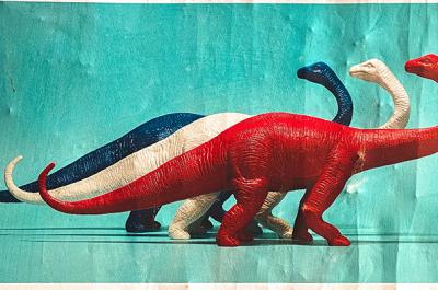 Drawing of three dinosaurs, one red, one white, and one blue.