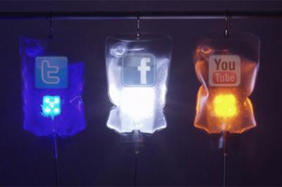 Colored IV bags with the logos of popular social media sites: Twitter, Facebook, and YouTube