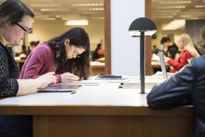 Students studying together in a library