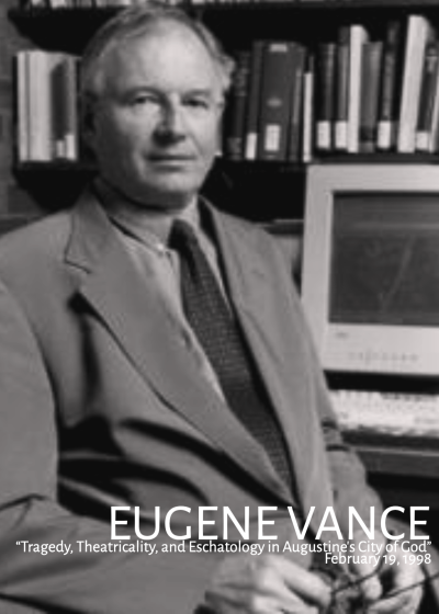 A black and white image of Eugene Vance sitting in front of a computer on a bookcase.