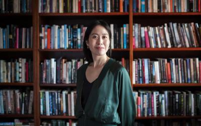 Tiffany Tsao in front of a bookshelf. Photo by Joy Mei En Lai.