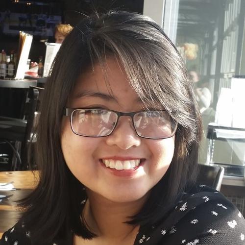 A portrait of Anna Nguyen wearing glasses.