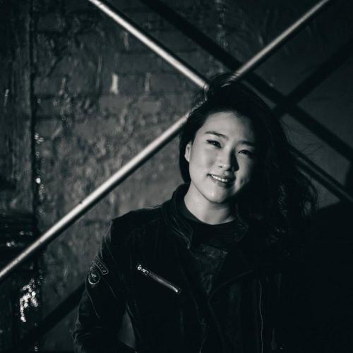 A black and white portrait of Sarah Choi.