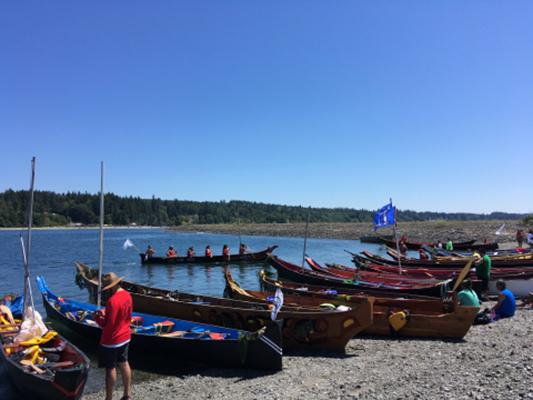 Canoe families request permission to come ashore to the Port Gamble S'Klallam Tribe during the 2018 Power Paddle to Puyallup Canoe Journey.
