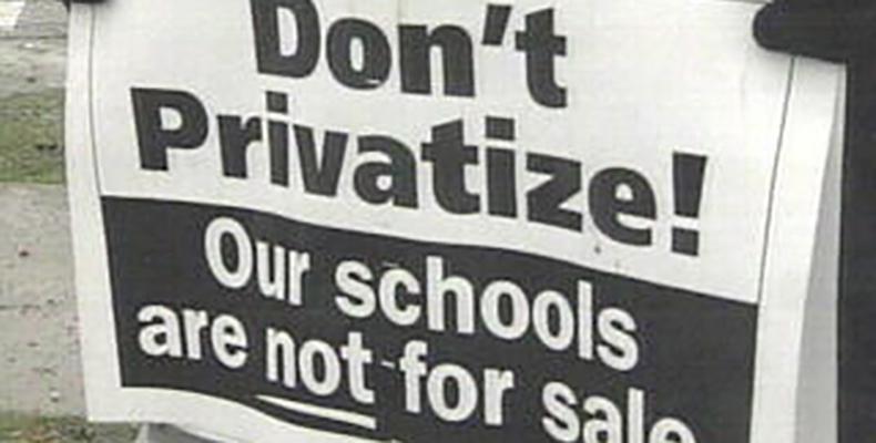 Photo of a sign with the words Don't Privatize! Our schools are not for sale.