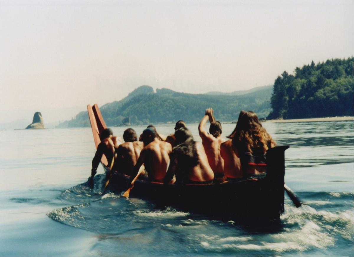 group canoing on the coast