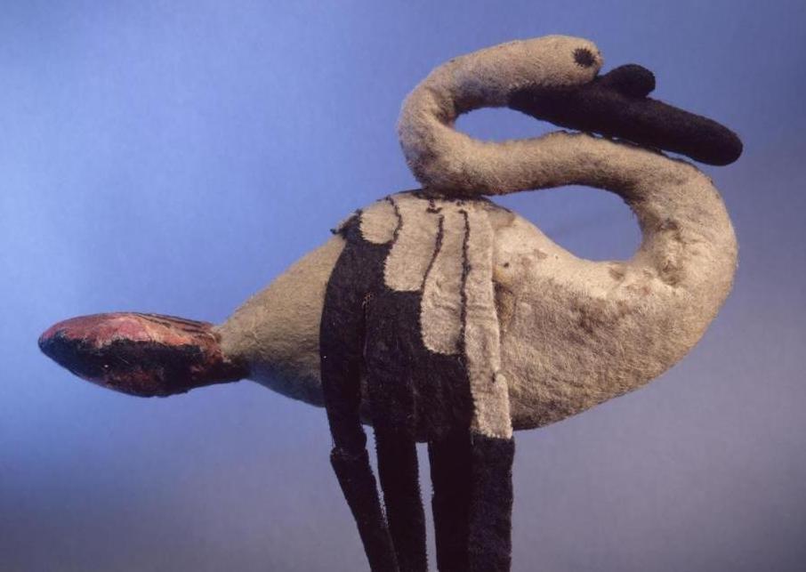 Felted Swan by Pazyryk Culture. 5th - 4th century BCE. Shades of blue in the background with a swan made of felt in the foreground.