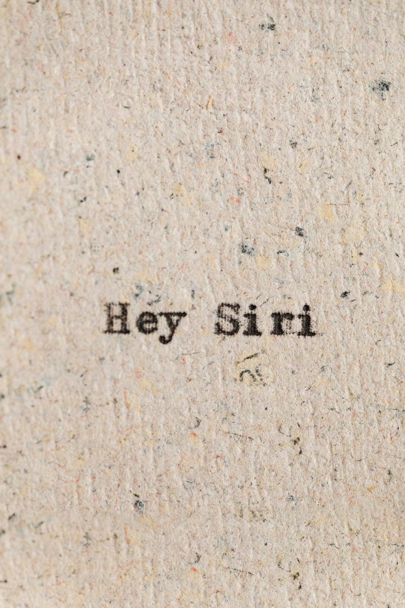 "Hey Siri" typed on parchment paper