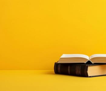 two books against a yellow backdrop