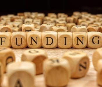 wooden blocks spelling funding