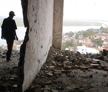A figure stands in the ruined E.J. Roye Building in Monrovia, Liberia, in 2012. All photos courtesy Danny Hoffman.