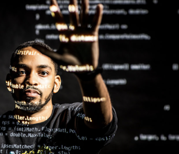 african american male-presenting profile reaching toward the camera with TEI coding projected across his face and hands