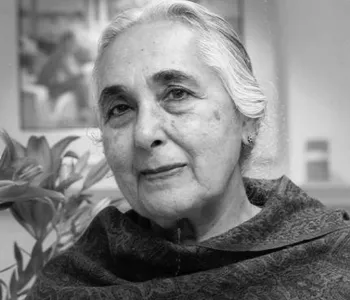 Black and white image of Romila Thapar looking into the camera.