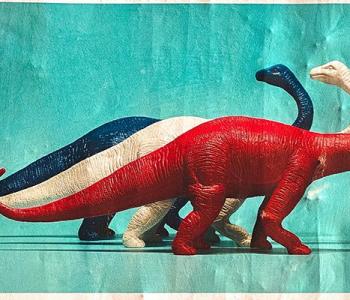 Drawing of three dinosaurs, one red, one white, and one blue.
