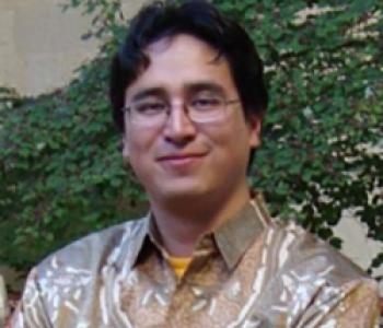 A portrait of Jorge Bayona wearing a collared shirt.