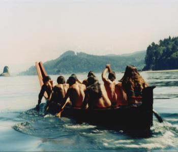 group canoing on the coast