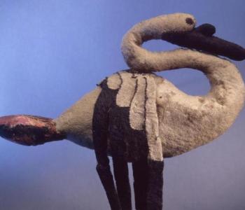 A photo of a swan made out of fabric.