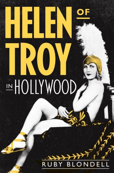 The cover of this book has the title, Helen of Troy, in large yellow letters on the upper left with an image of a woman in a Roman warrior headdress diagonally across the rest of the page.