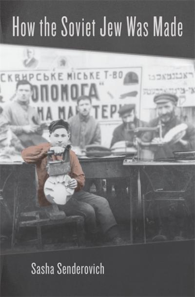 Black and white image of several men looking at the camera with a boy wearing a ping sweater vest in the foreground.